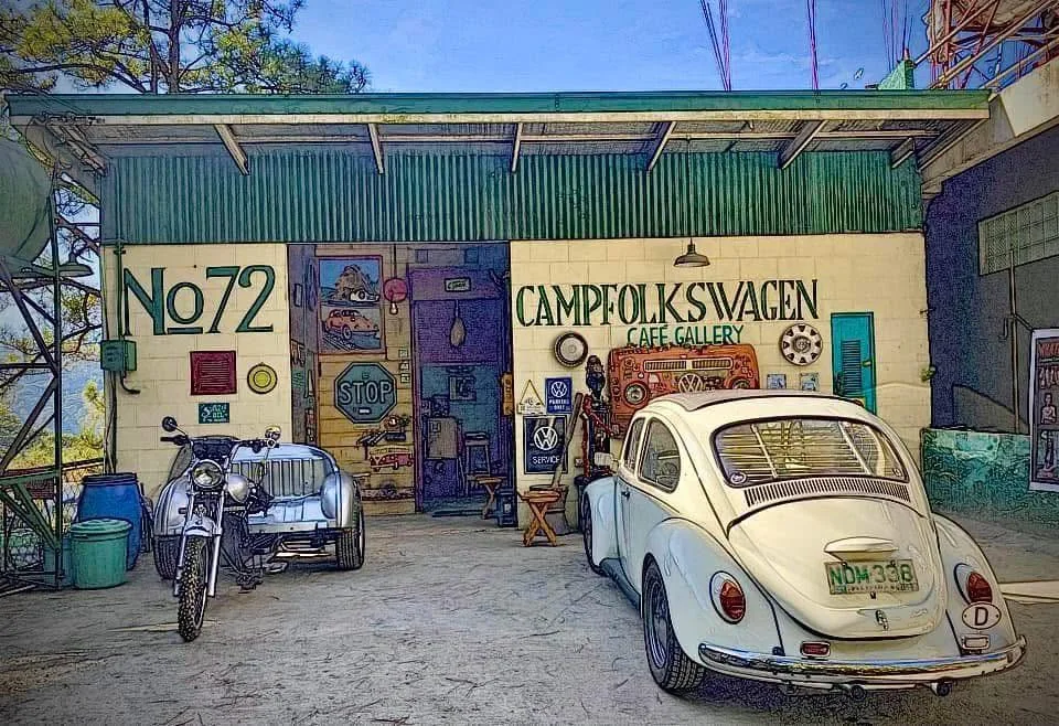 Campfolkswagen frontage with a classic Volkswagen Beetle and motorcycles